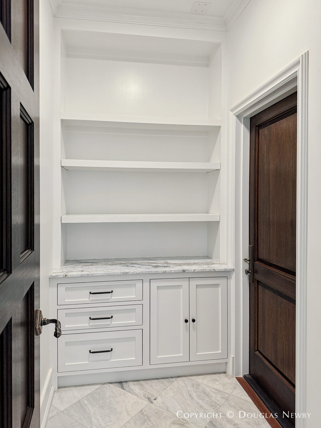 The home at 4400 Belfort Place in Highland Park, Dallas, Texas, has a separate exterior door to a mail and package delivery room.